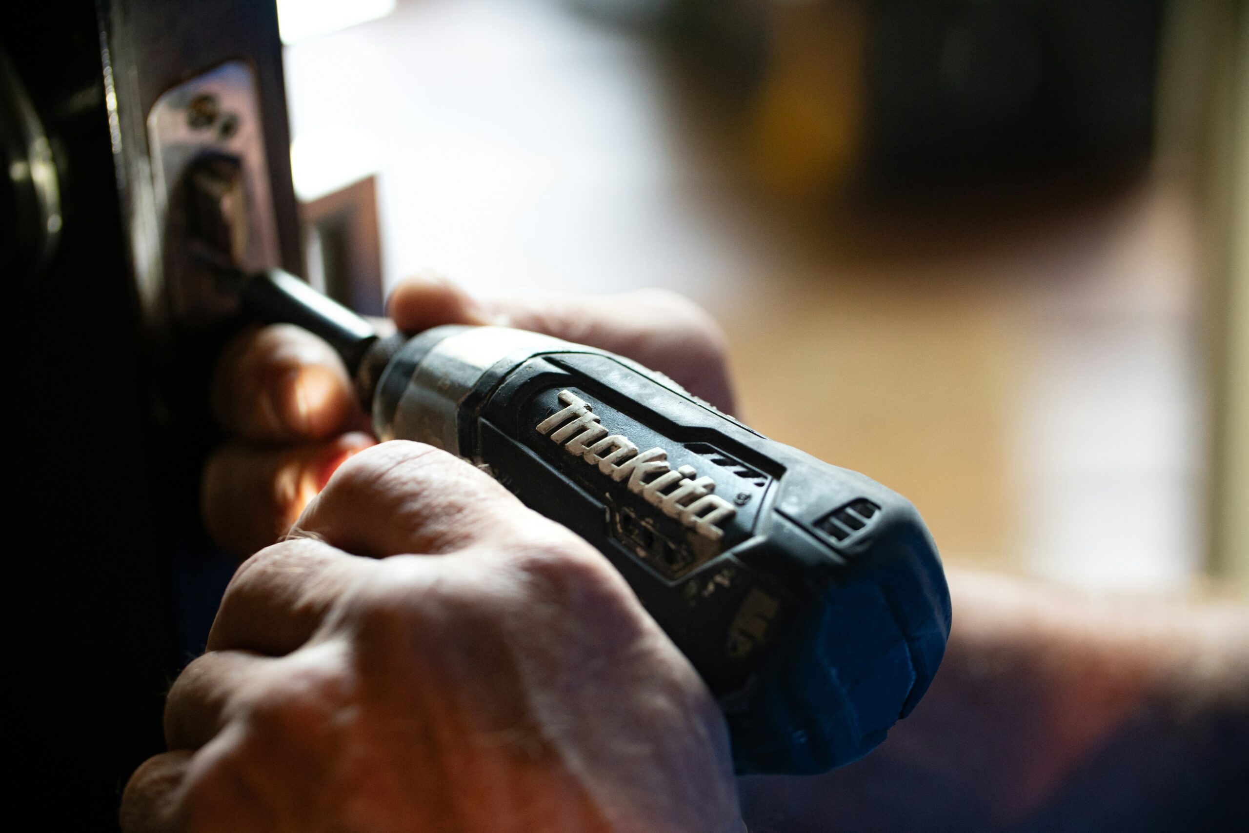 hand using a drill